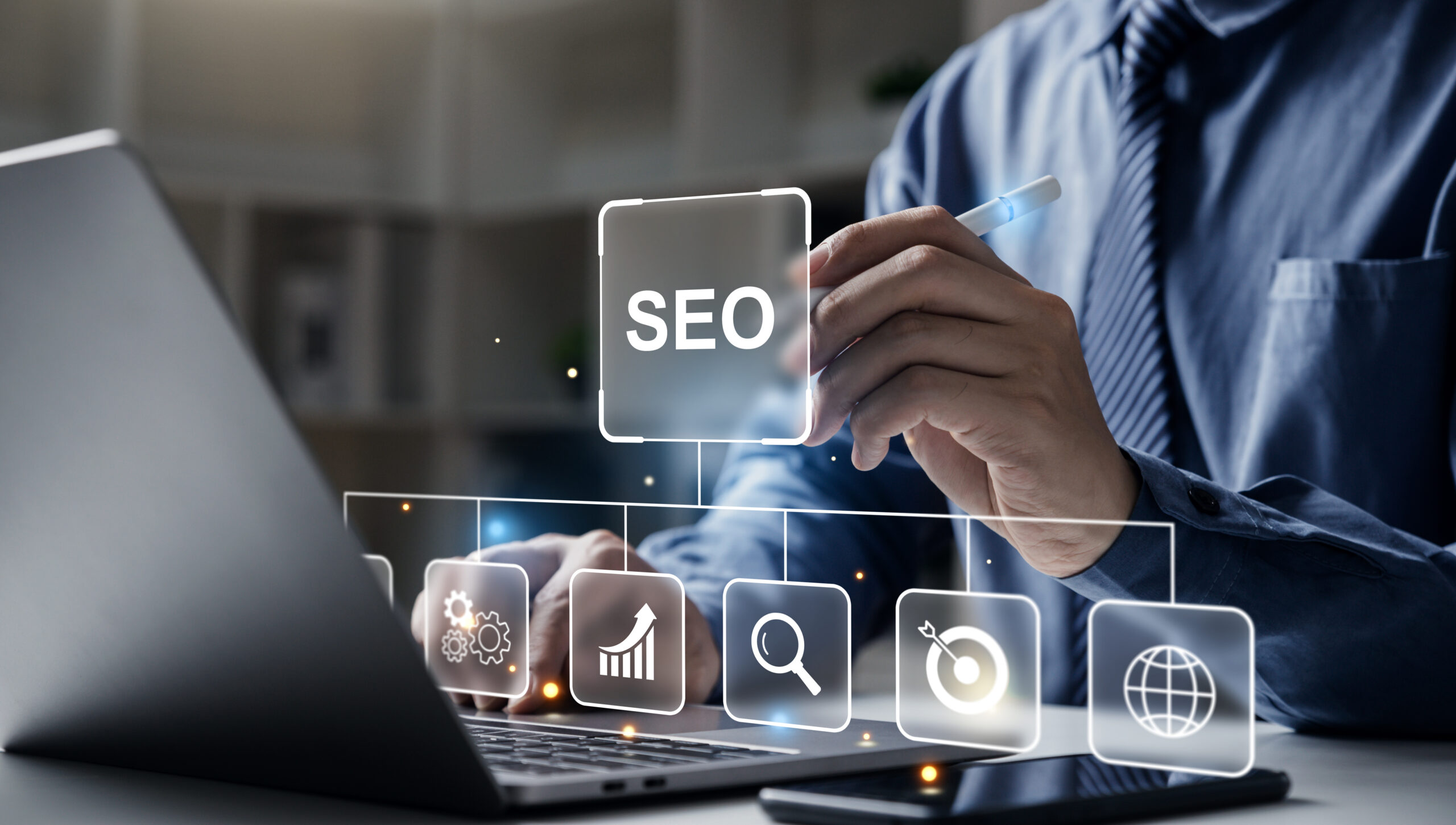 Hand of businessman holding a pen pointing to SEO Search Engine